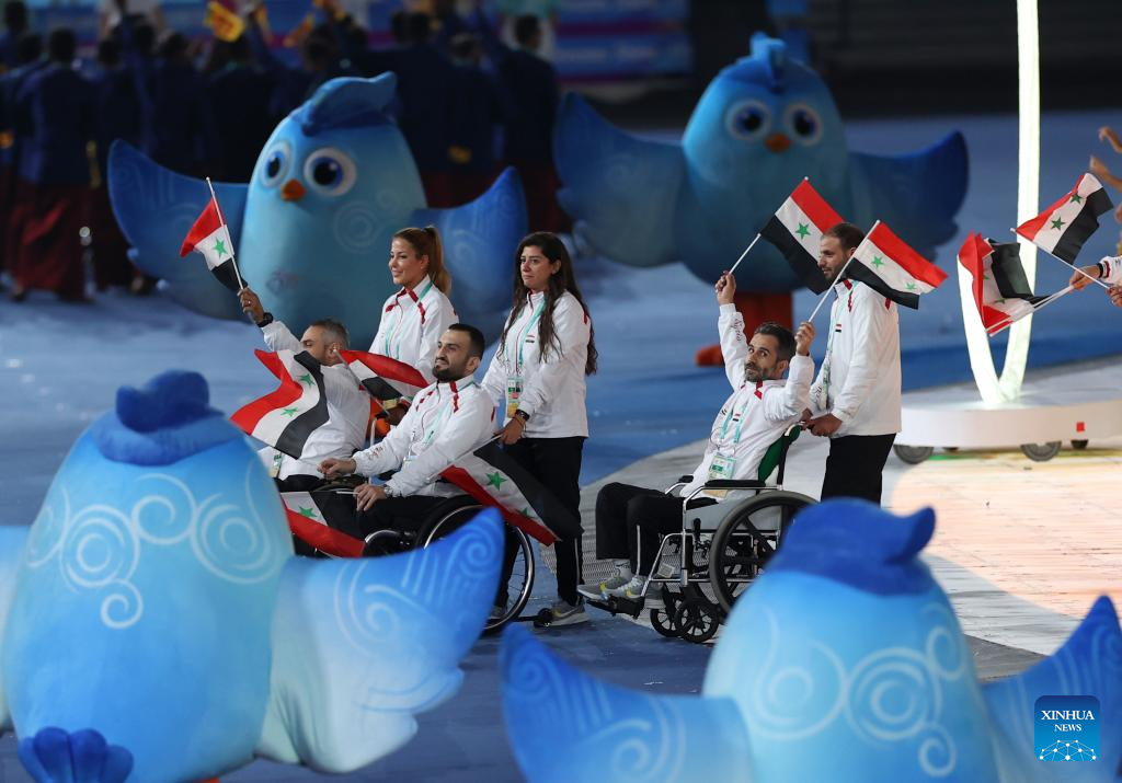 Delegations parade into stadium during opening ceremony of 4th Asian Para Games in Hangzhou