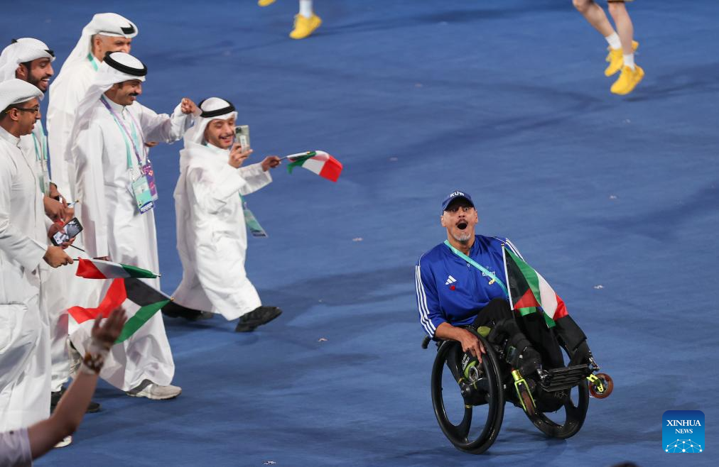 Delegations parade into stadium during opening ceremony of 4th Asian Para Games in Hangzhou