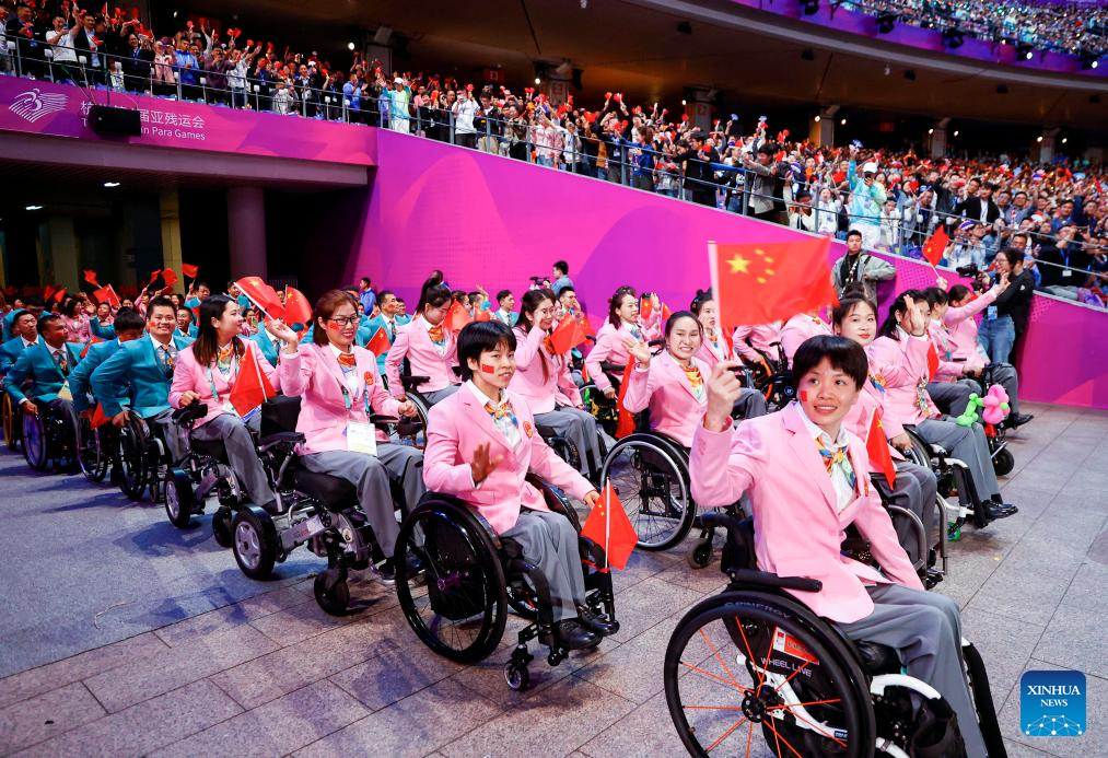 Delegations parade into stadium during opening ceremony of 4th Asian Para Games in Hangzhou