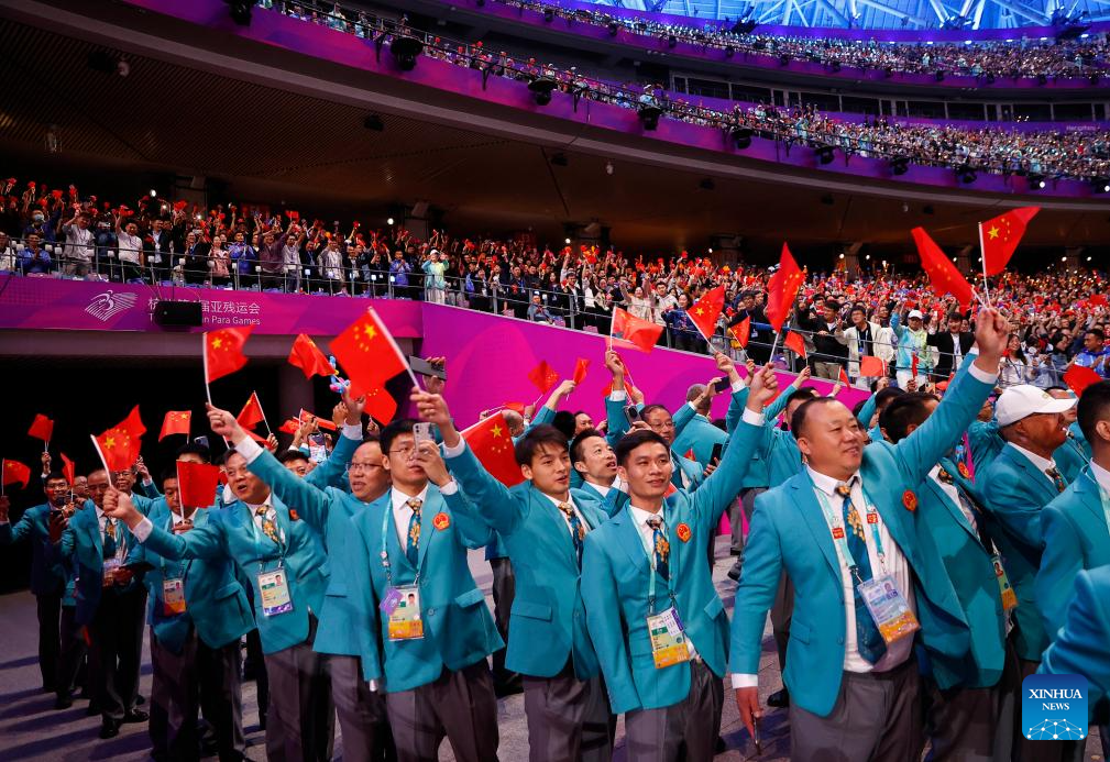 Delegations parade into stadium during opening ceremony of 4th Asian Para Games in Hangzhou