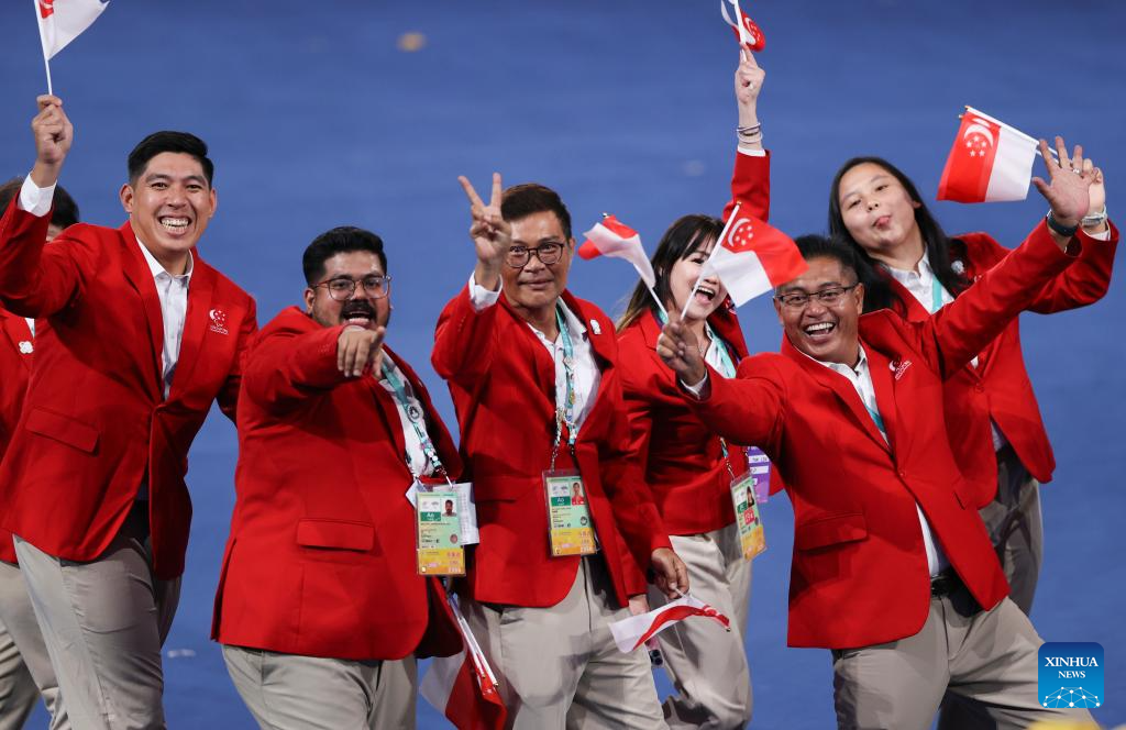 Delegations parade into stadium during opening ceremony of 4th Asian Para Games in Hangzhou