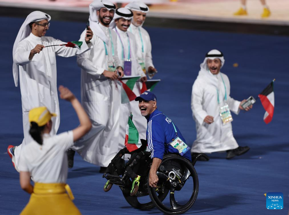 Delegations parade into stadium during opening ceremony of 4th Asian Para Games in Hangzhou
