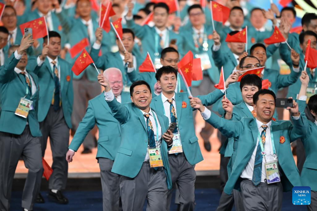 Delegations parade into stadium during opening ceremony of 4th Asian Para Games in Hangzhou