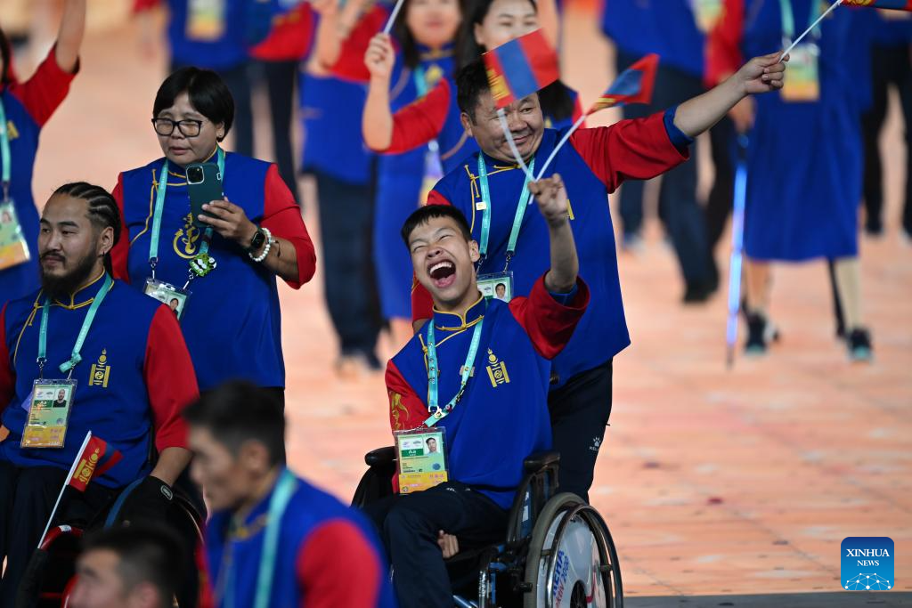 Delegations parade into stadium during opening ceremony of 4th Asian Para Games in Hangzhou