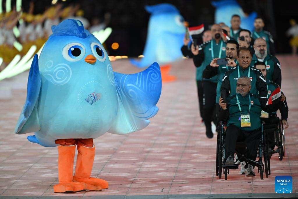 Delegations parade into stadium during opening ceremony of 4th Asian Para Games in Hangzhou