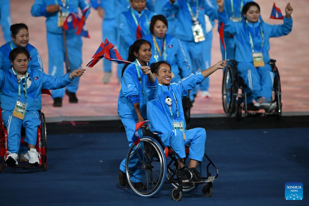 Delegations parade into stadium during opening ceremony of 4th Asian Para Games in Hangzhou