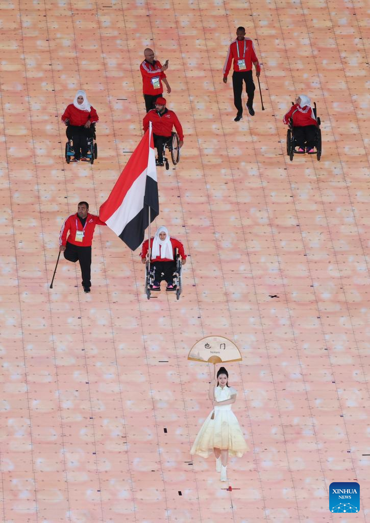 Delegations parade into stadium during opening ceremony of 4th Asian Para Games in Hangzhou
