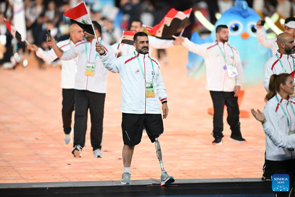 Delegations parade into stadium during opening ceremony of 4th Asian Para Games in Hangzhou