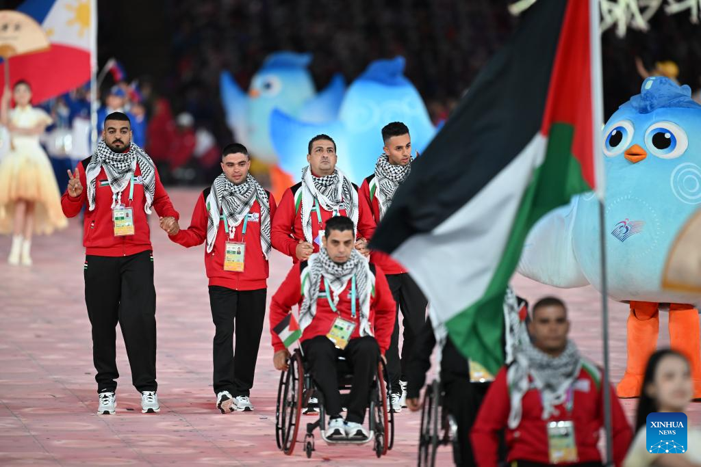 Delegations parade into stadium during opening ceremony of 4th Asian Para Games in Hangzhou