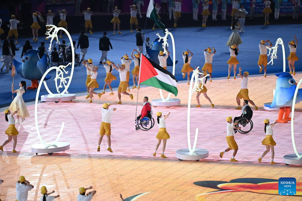 Delegations parade into stadium during opening ceremony of 4th Asian Para Games in Hangzhou