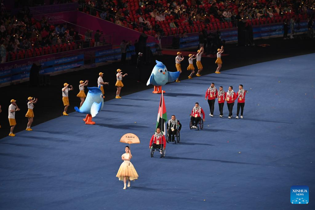 Delegations parade into stadium during opening ceremony of 4th Asian Para Games in Hangzhou