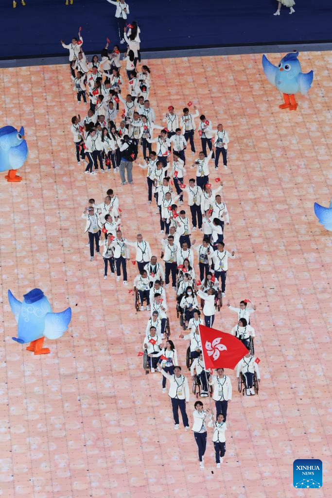 Delegations parade into stadium during opening ceremony of 4th Asian Para Games in Hangzhou