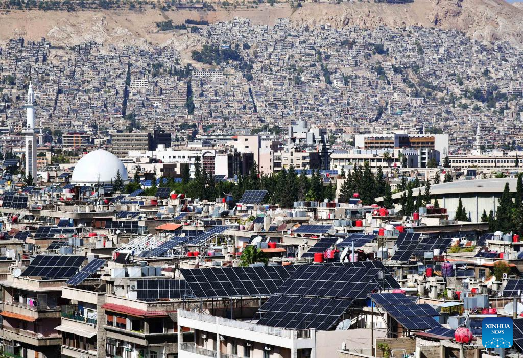 Solar panels seen on rooftops in Damascus, Syria