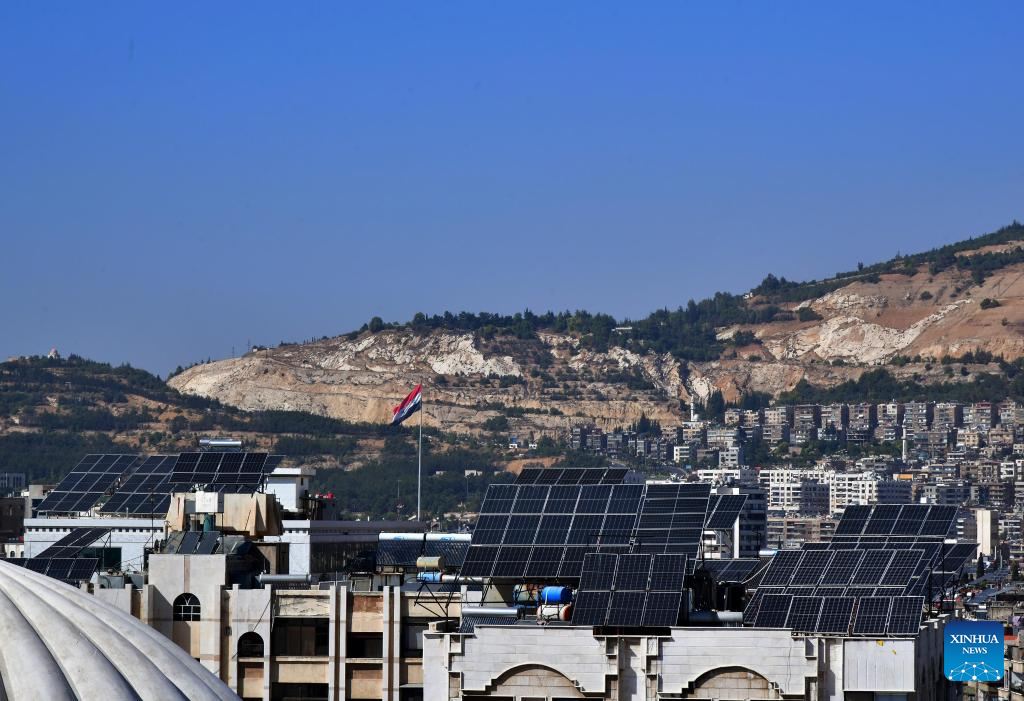 Solar panels seen on rooftops in Damascus, Syria