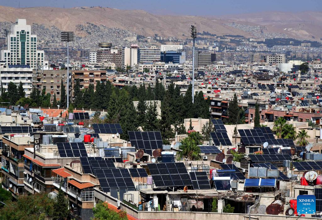 Solar panels seen on rooftops in Damascus, Syria