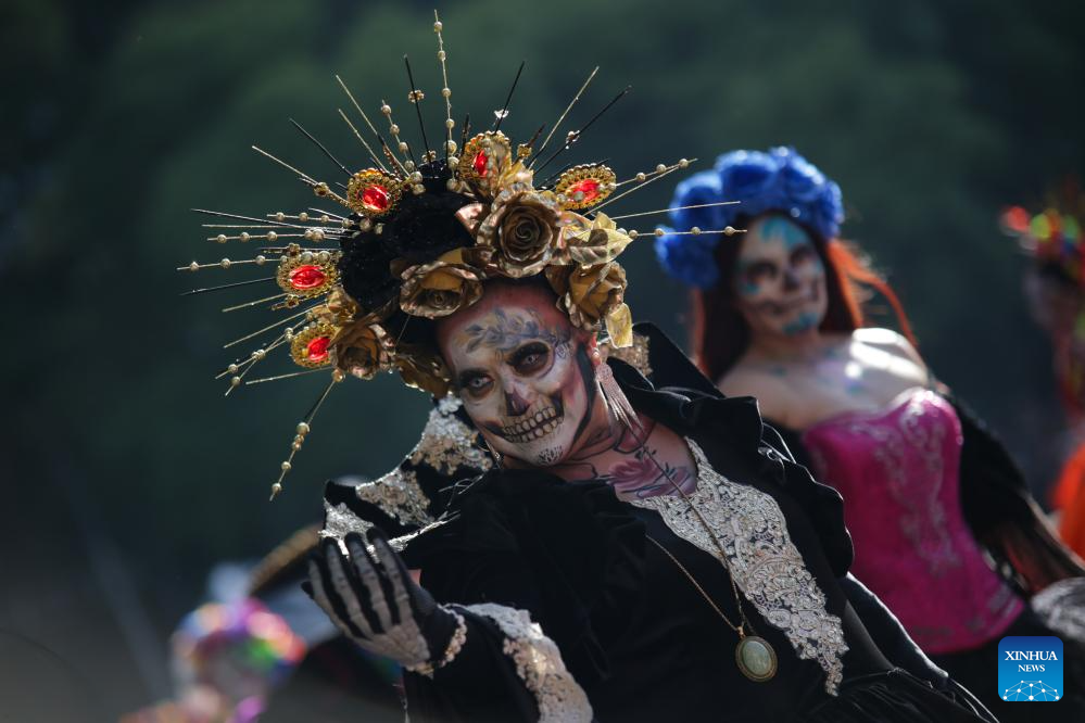 People take part in Day of Dead Parade in Mexico City