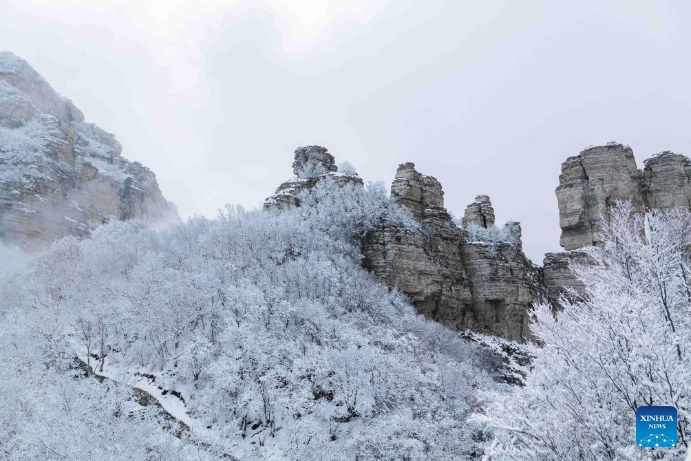 Baishi Mountain covered in snow in Laiyuan County, N China