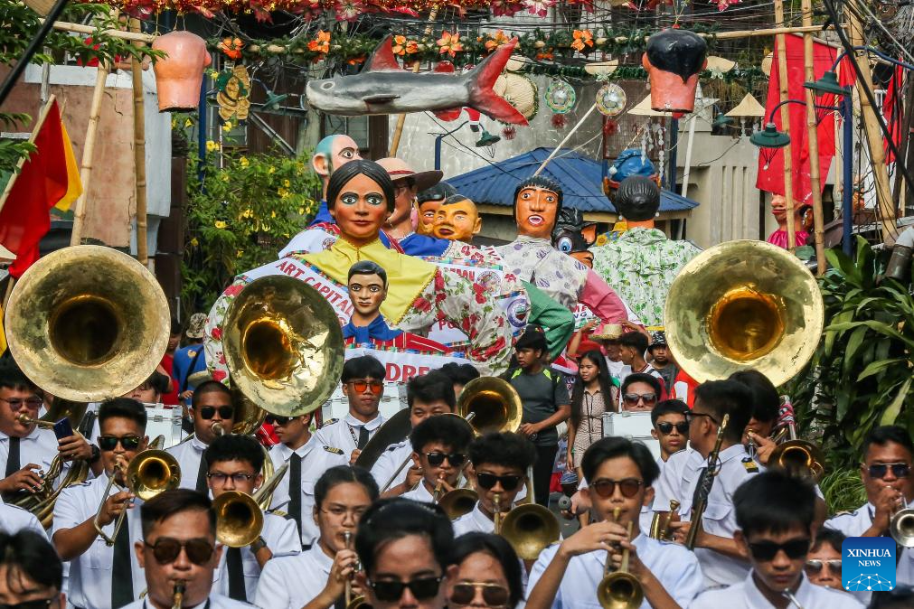 Papier-mache puppets paraded to celebrate Higantes Festival in Philippines