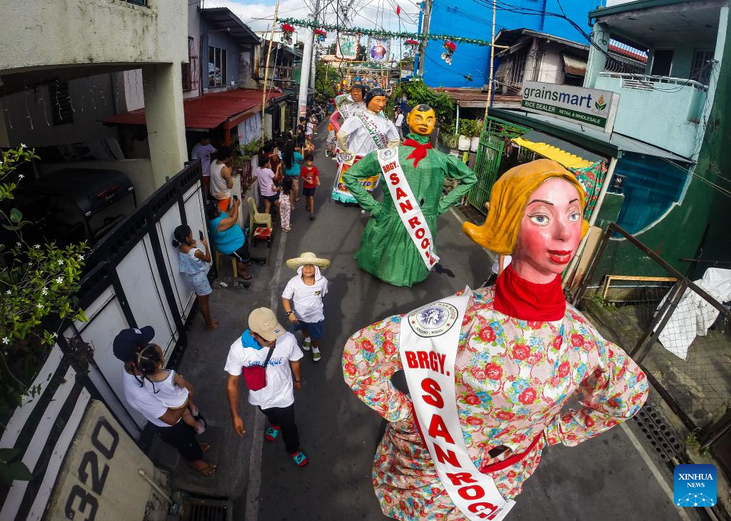 Papier-mache puppets paraded to celebrate Higantes Festival in Philippines