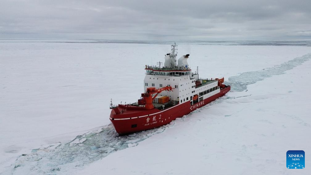 China's research icebreaker Xuelong 2 sails through ice floes