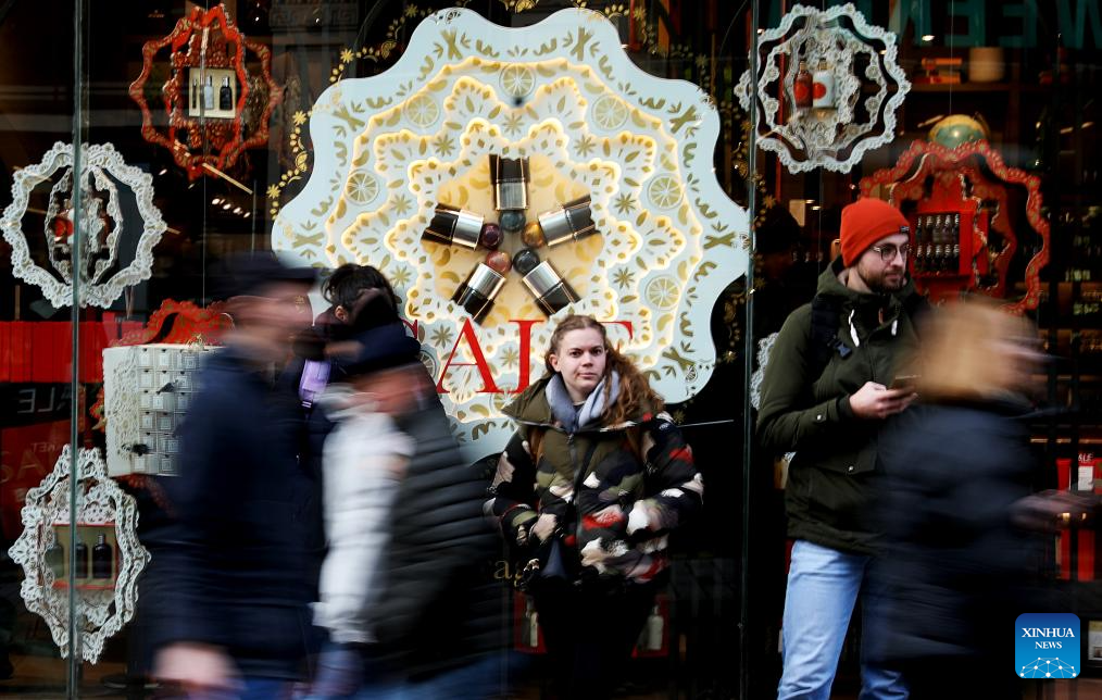 People go shopping during Boxing Day sales in London
