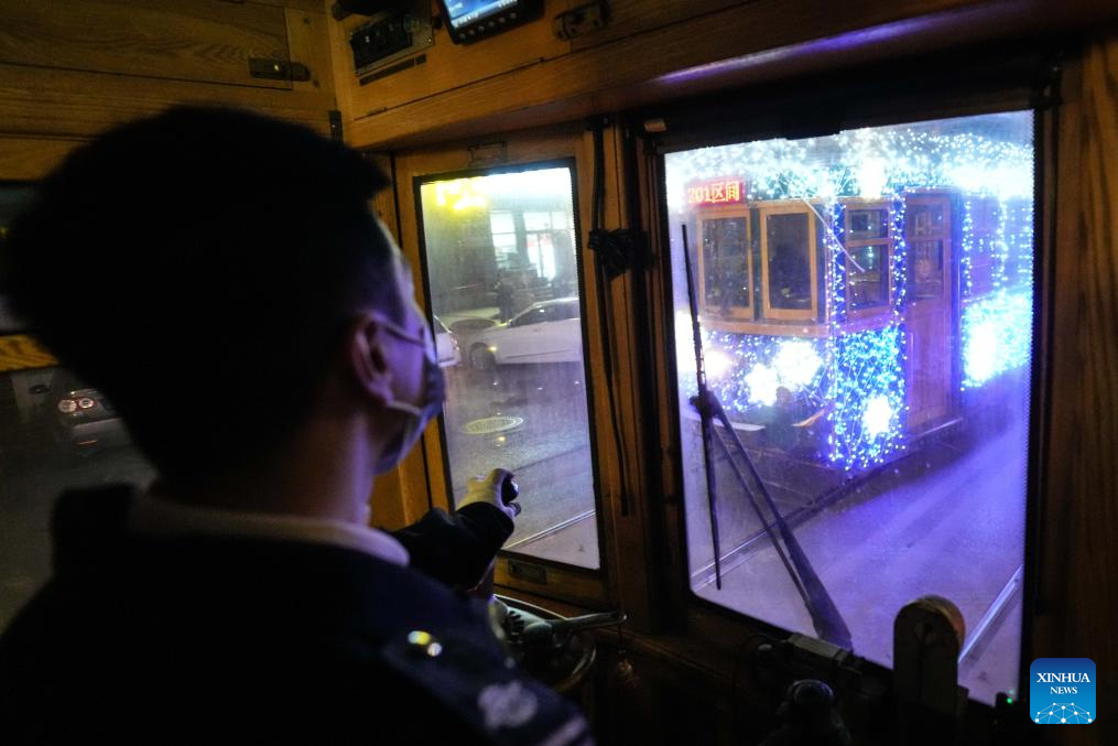 Trams decorated with lights to attract tourists in Dalian, China's Liaoning