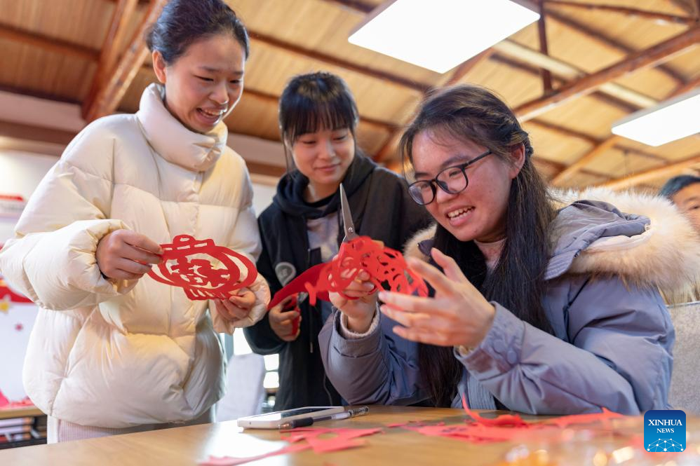 People across China prepare for upcoming Spring Festival