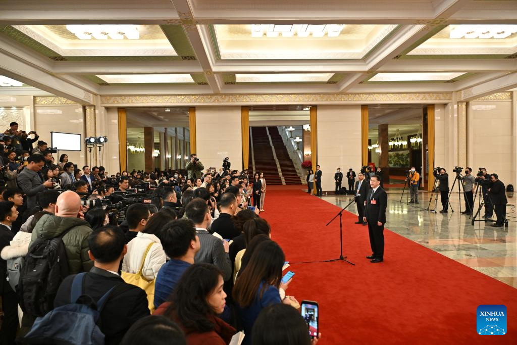 Ministers interviewed after opening meeting of second session of 14th NPC