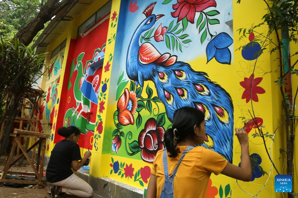 Students paint traditional paper works for Bengali New Year in Bangladesh