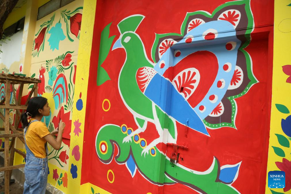 Students paint traditional paper works for Bengali New Year in Bangladesh