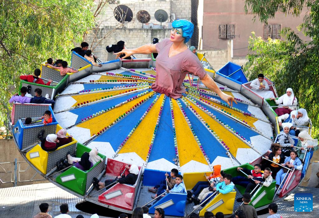 People enjoy themselves during Eid al-Fitr holiday across world