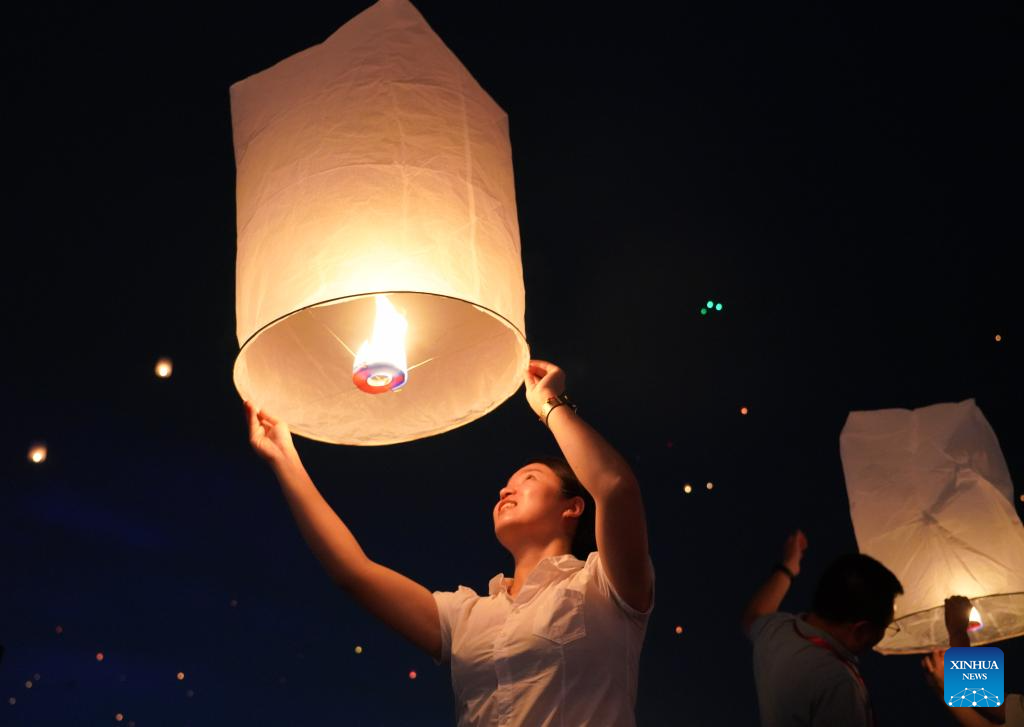 People fly Kongming lanterns to celebrate New Year of calendar of Dai ethnic group