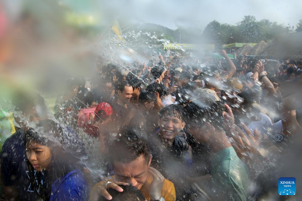 People spray water to celebrate water festival in Myanmar