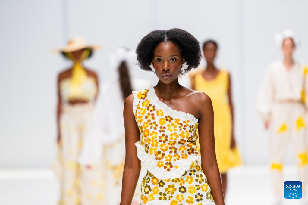 Models present creations during South African Fashion Week in Johannesburg