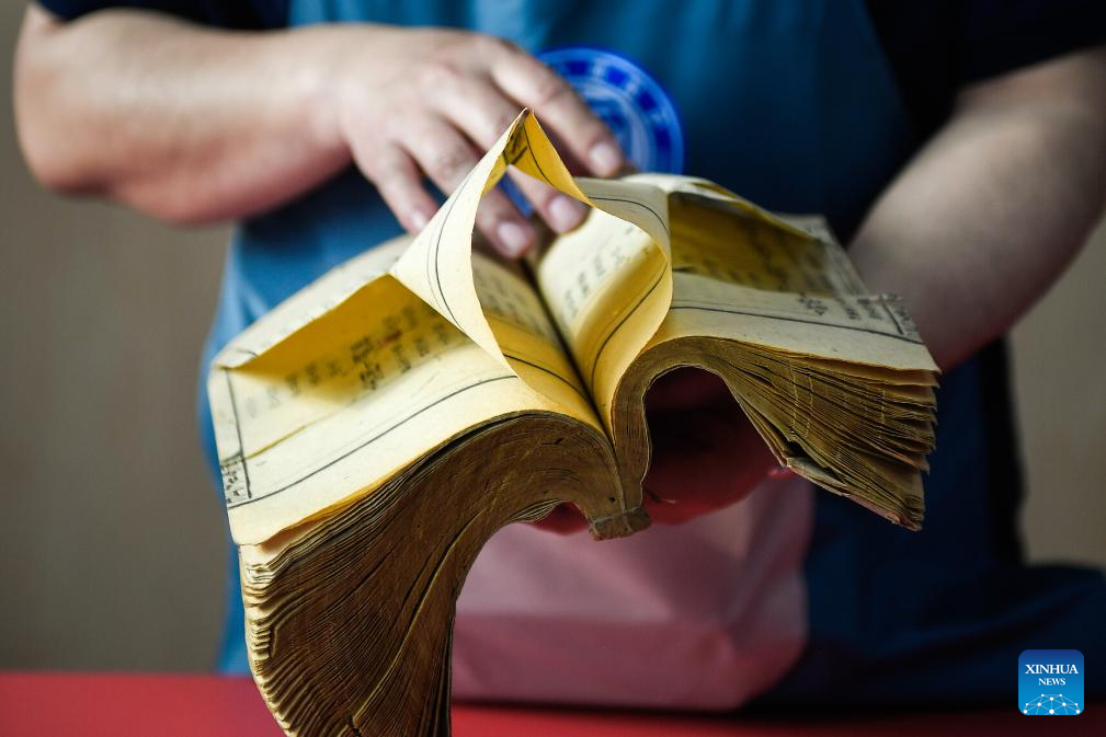 Ancient book restorers bring broken old books 