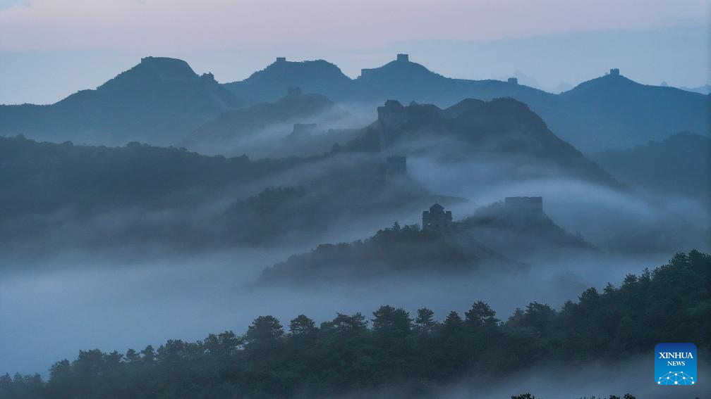 Scenery of Jinshanling section of Great Wall shrouded in clouds in Hebei