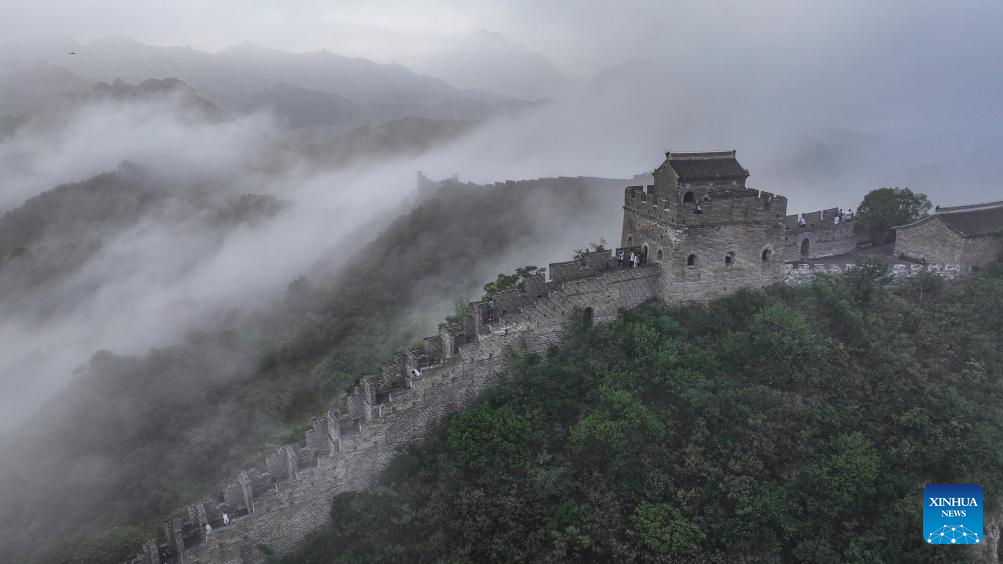 Scenery of Jinshanling section of Great Wall shrouded in clouds in Hebei