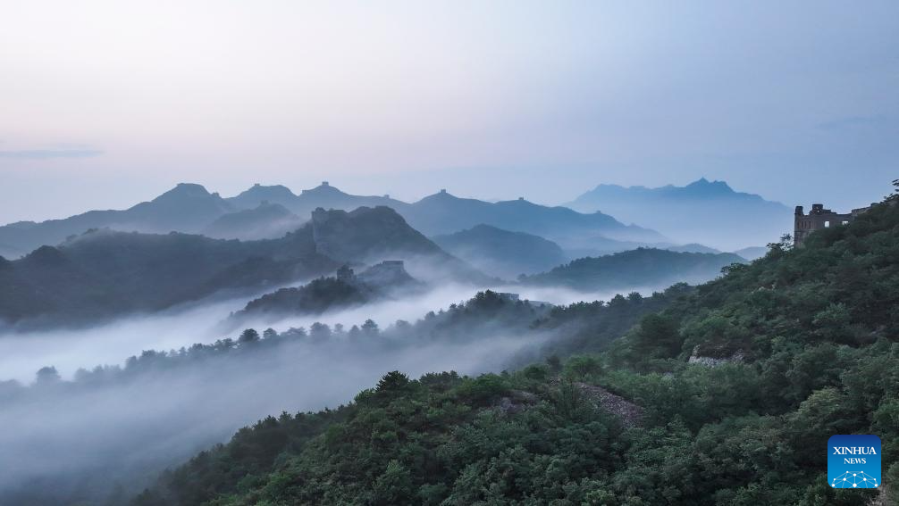 Scenery of Jinshanling section of Great Wall shrouded in clouds in Hebei