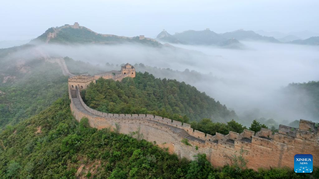 Scenery of Jinshanling section of Great Wall shrouded in clouds in Hebei