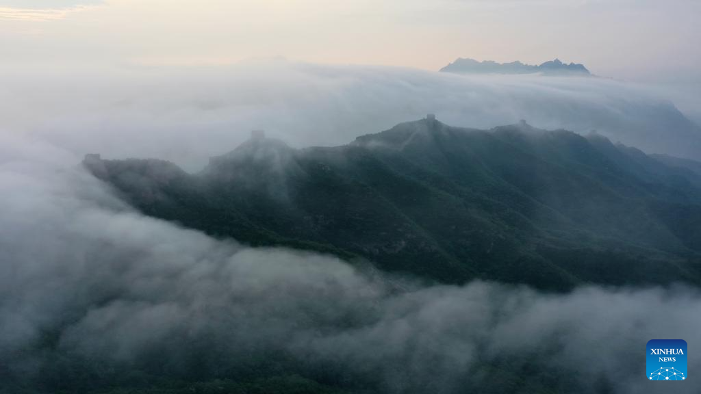 Scenery of Jinshanling section of Great Wall shrouded in clouds in Hebei