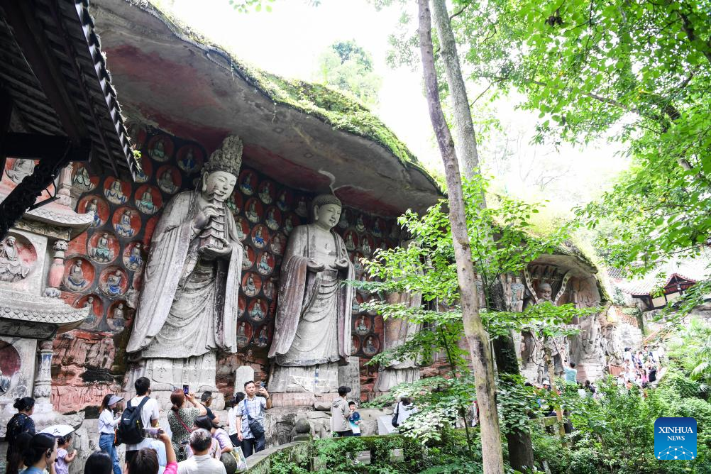 Tourists visit scenic spot of Dazu Rock Carvings in China's Chongqing