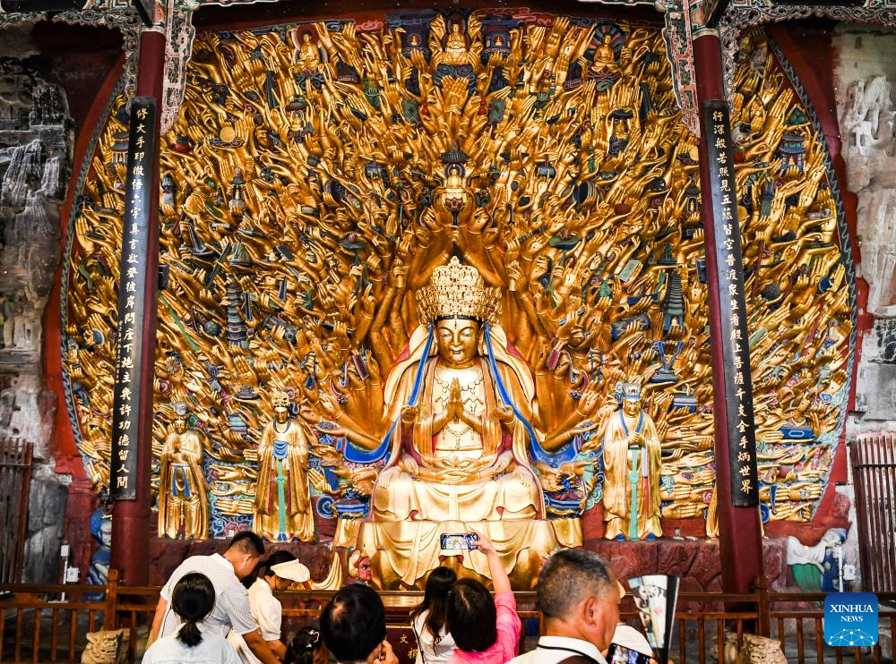 Tourists visit scenic spot of Dazu Rock Carvings in China's Chongqing