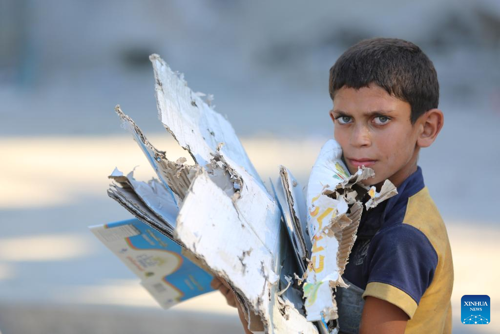 People conduct clean up work at UN