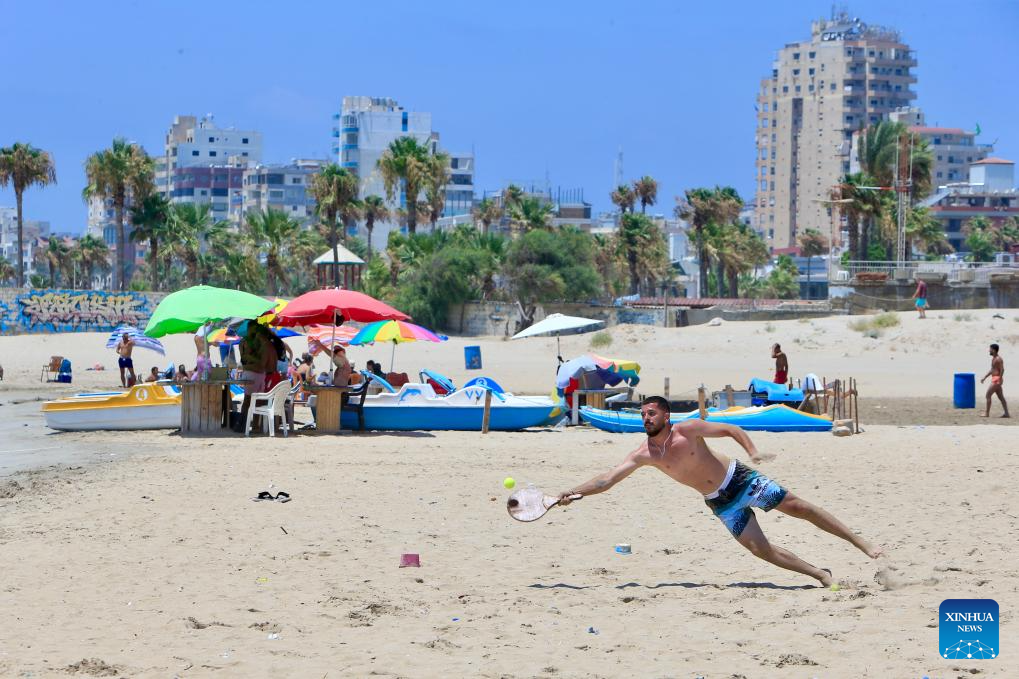 People have fun at seaside in Tyre, Lebanon