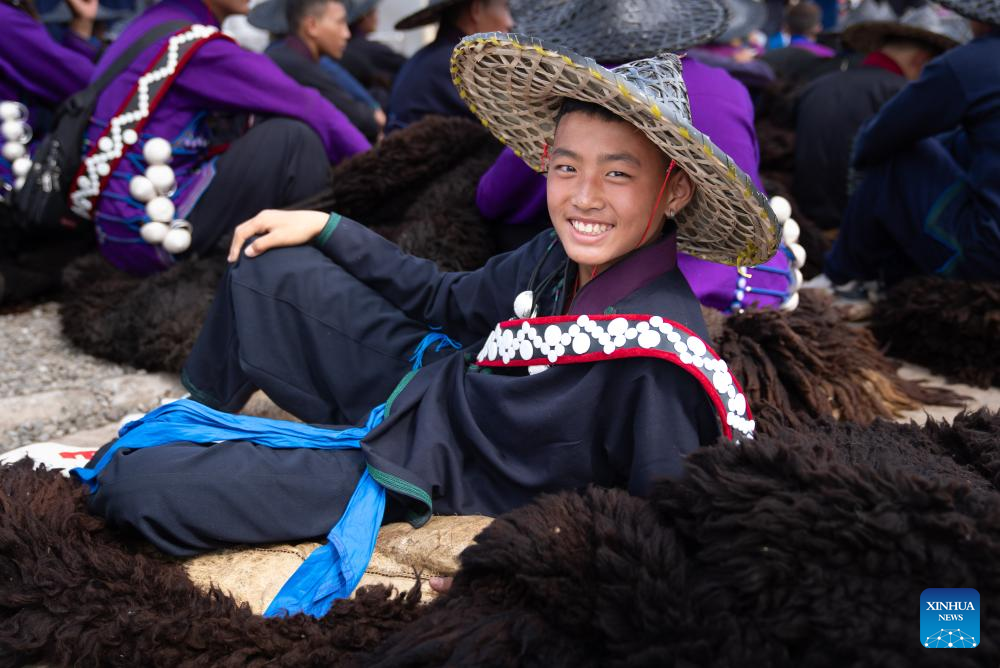 People dressed in traditional Yi costumes celebrate torch festival in China's Sichuan