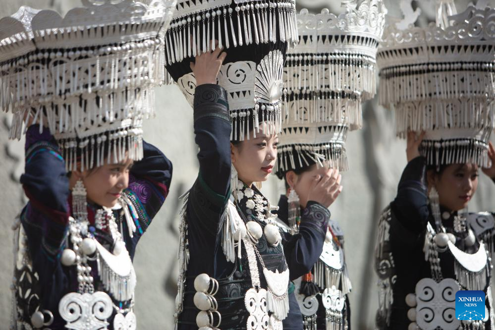 People dressed in traditional Yi costumes celebrate torch festival in China's Sichuan