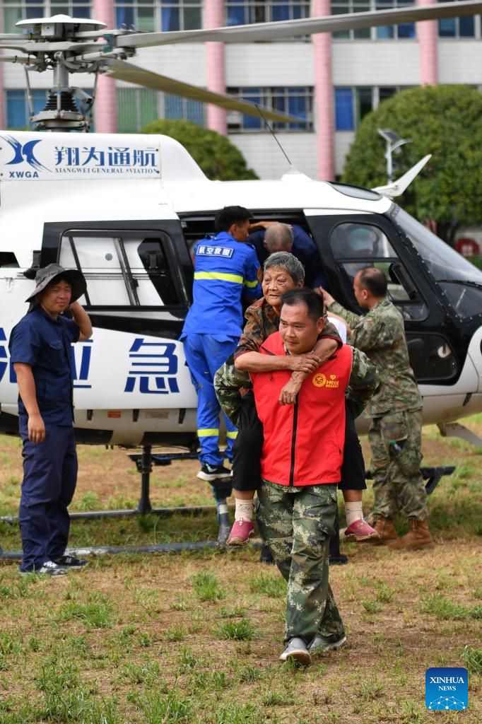 People stranded in waterlogged residences relocated in C China's Hunan