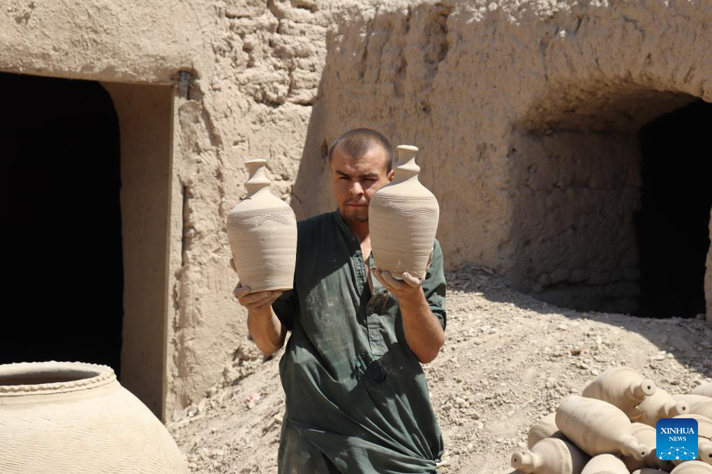 Potters make potteries in Dawlat Abad District, Afghanistan