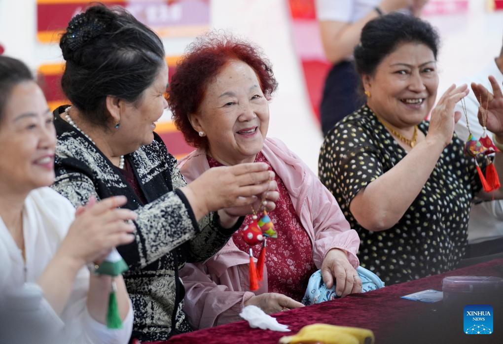 Feature: Xinjiang's multi-ethnic community fosters bonds of support, friendship