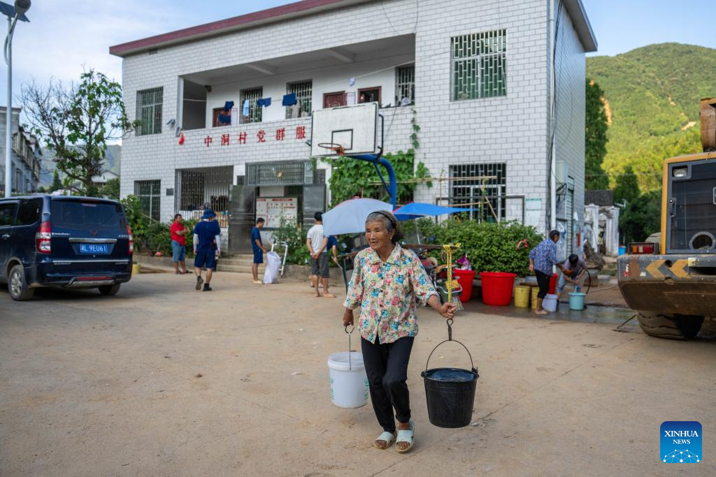 Communication, power supplies largely resume in flood-hit Chinese city